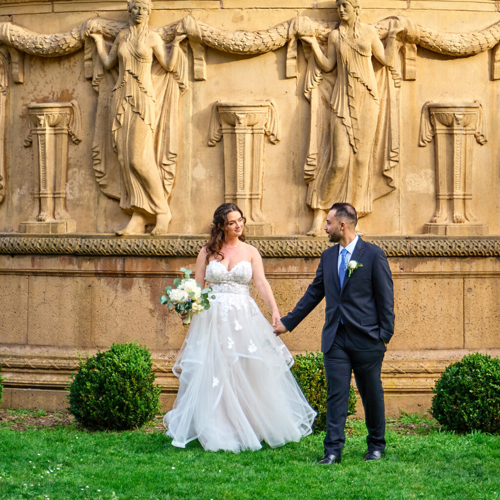 Photography of Bride and Groom Walking through The Palace of Fine Arts